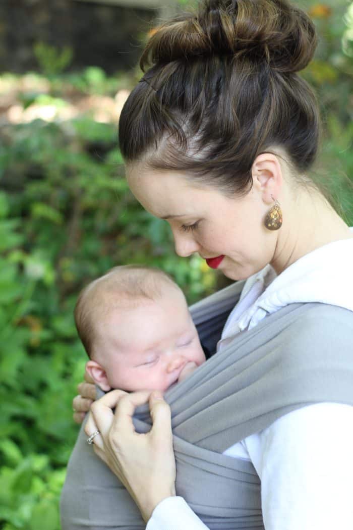 mother wearing her newborn baby using a Boba wrap