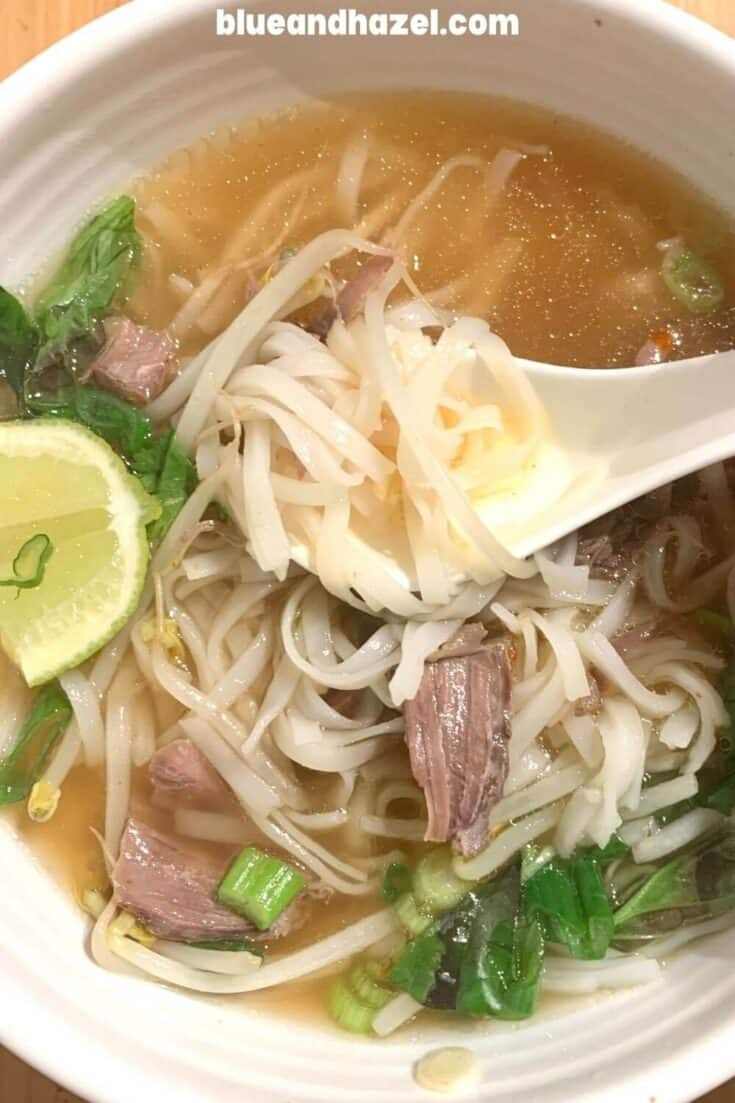 Homemade beef pho recipe in a white bowl