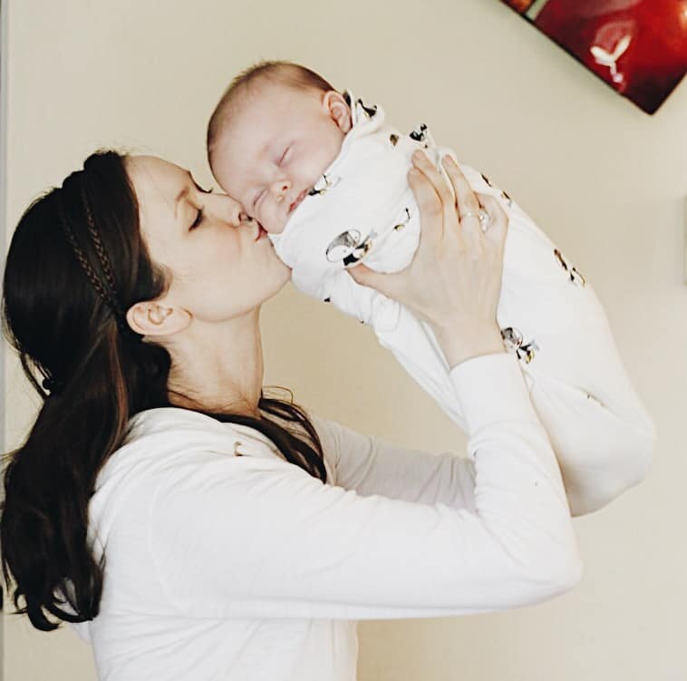Using a tripod to take photos with mommy and newborn