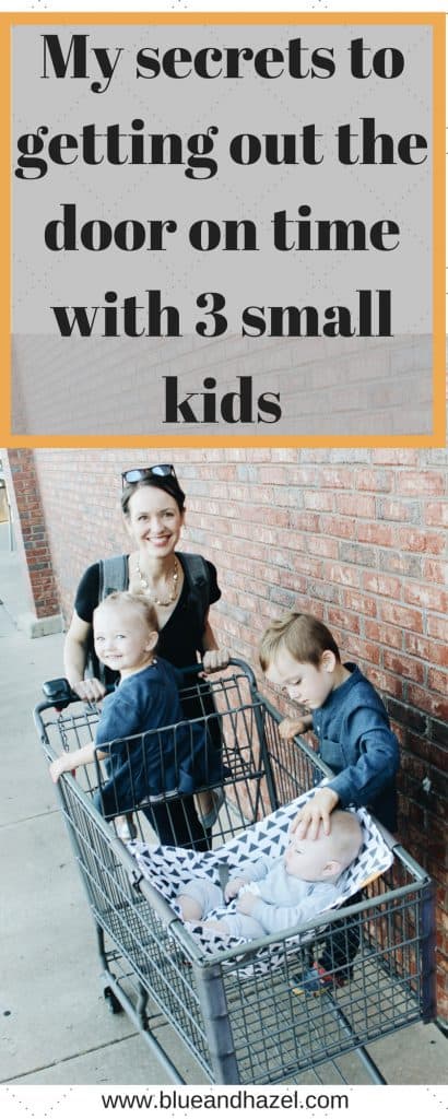 My secrets to getting out the door on time with three kids under four. Photo of a mom with three kids in a shopping cart next to a brick wall. 