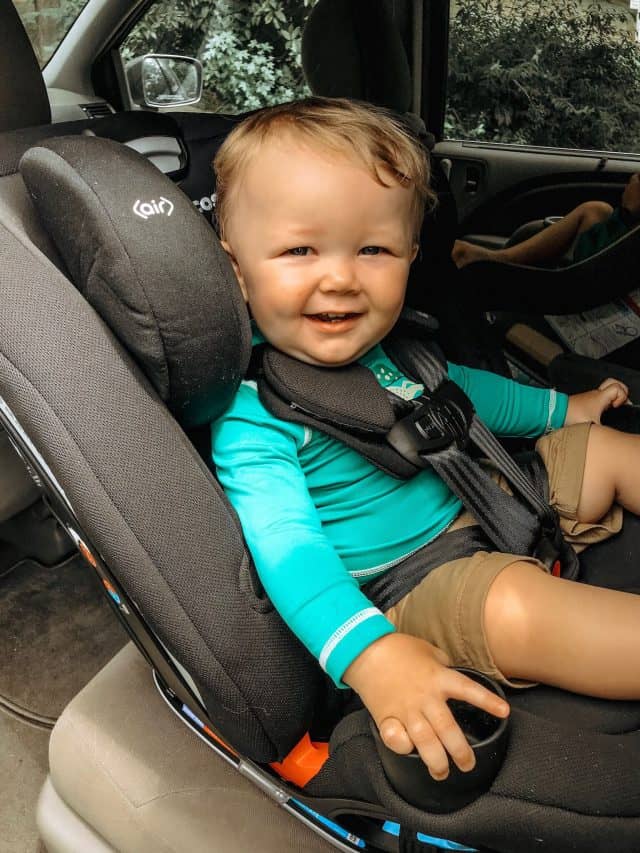 baby boy sitting in a black Maxi-Cosi Magellan 5-in-1 Convertible Car Seat