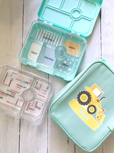 seafoam blue bento box from stuck on you with cooler bag showing a yellow tractor and extra plastic tray