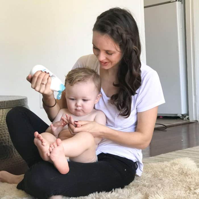 bath time with an 18 month old: A mom applying Baby Dove lotion