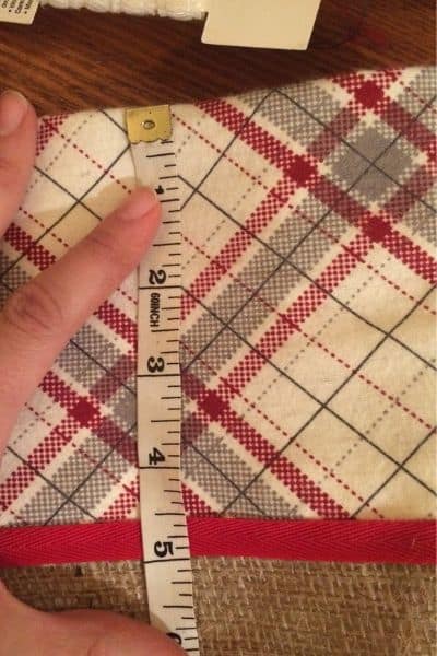 a measuring tape showing 5 inches for a burlap christmas stocking