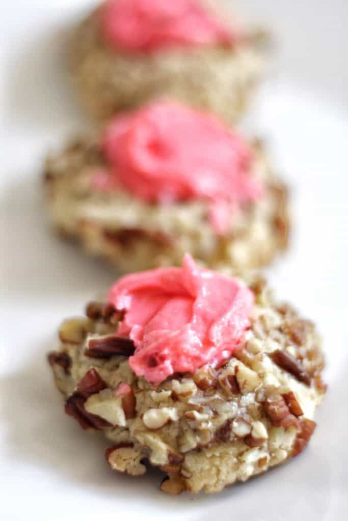 pink buttercream pecan thumbprint cookies