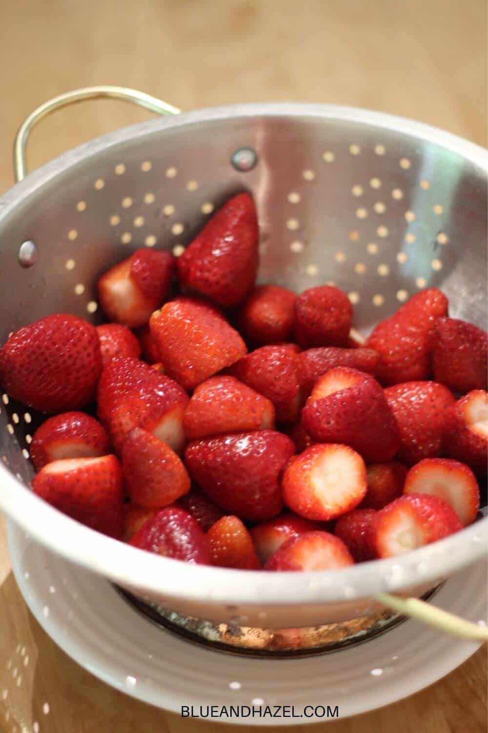 strawberries rinsed and cut for strawberry jam