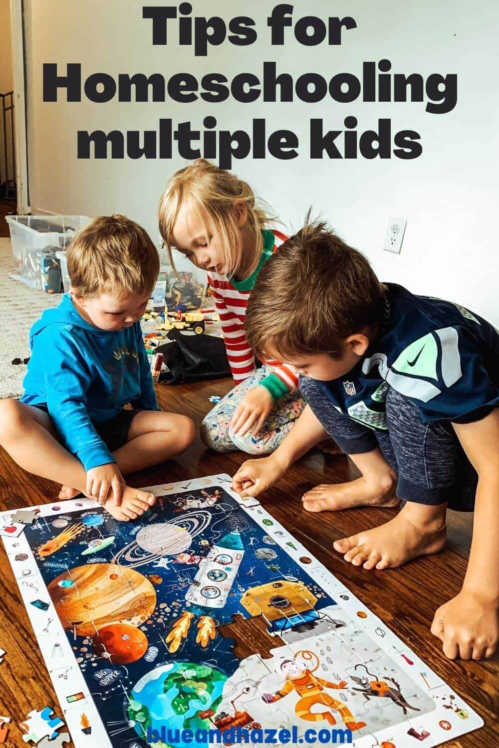 3 kids doing a space puzzle together during a homeschool day