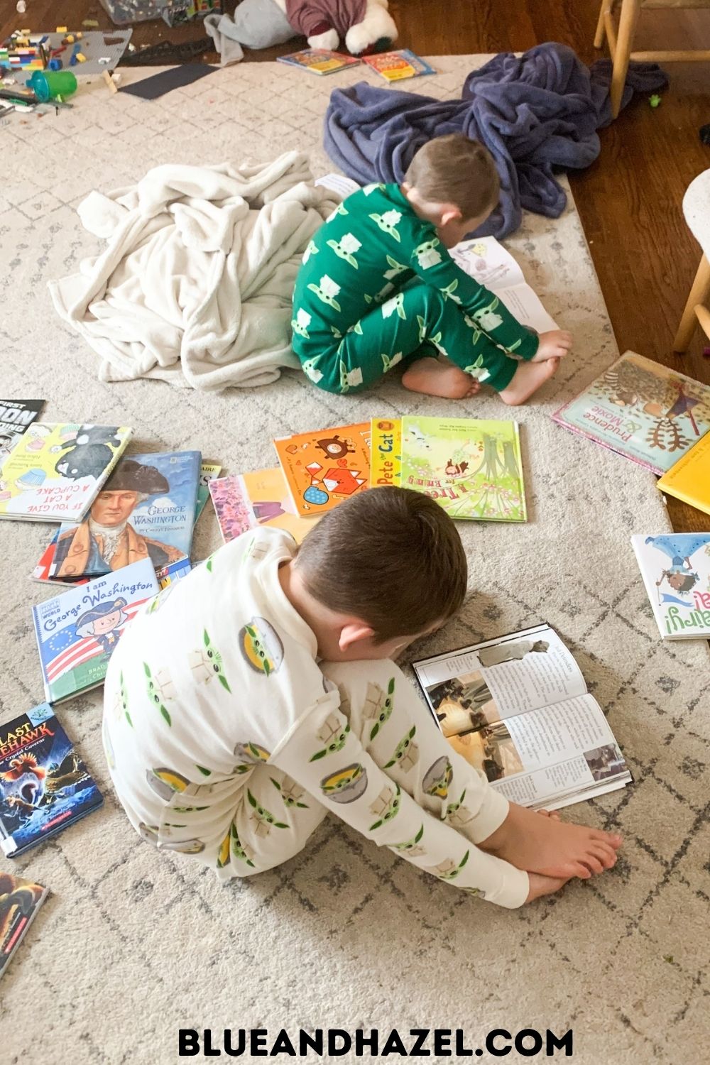 young boys in star wars pajamas looking at books. 