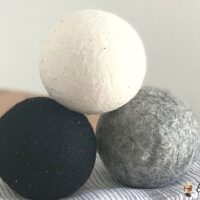 Dropps wool dryer balls in white, gray, and white