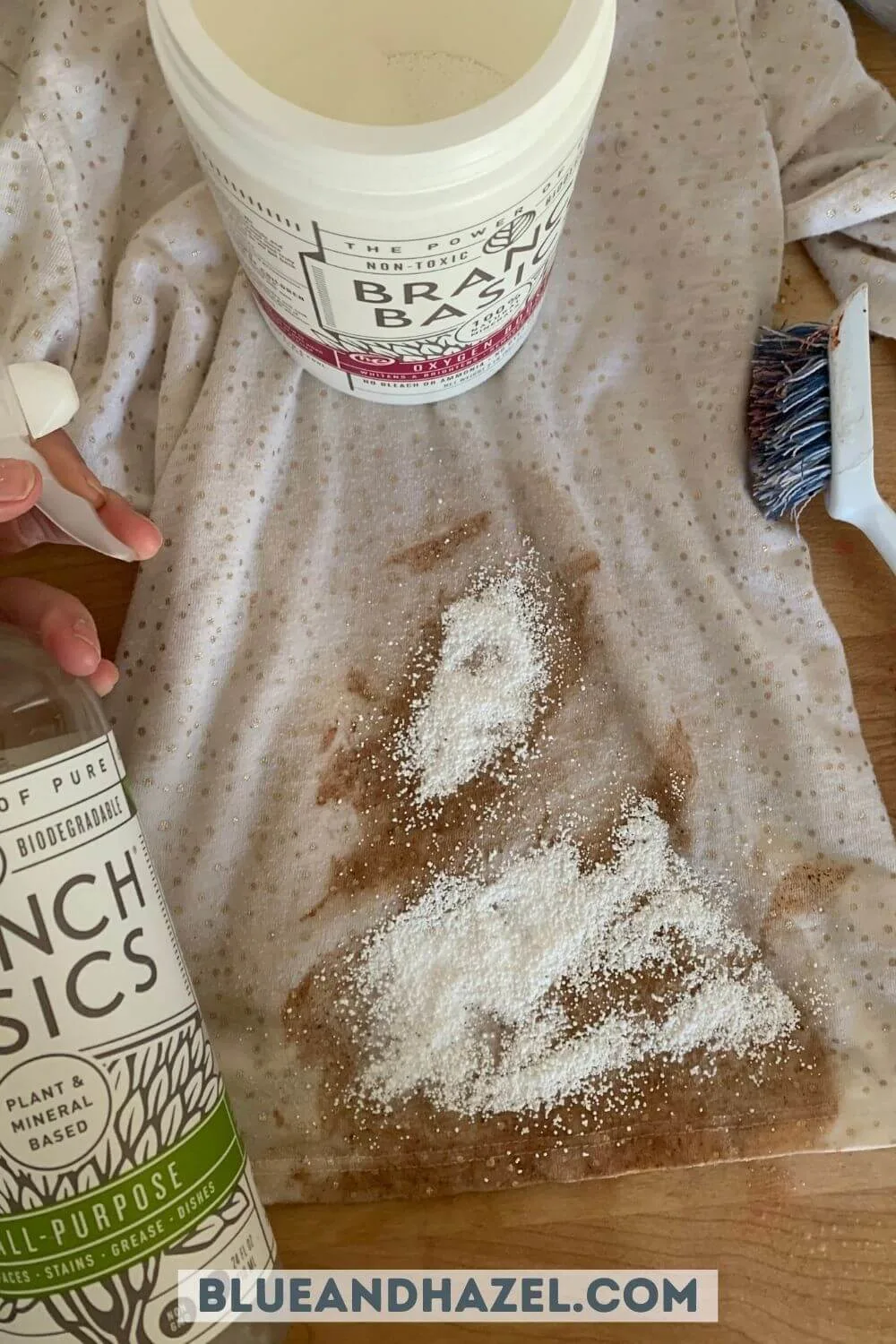 Chocolate smoothie stain on a white shirt with branch basics oxygen boost sprinkled on top. 