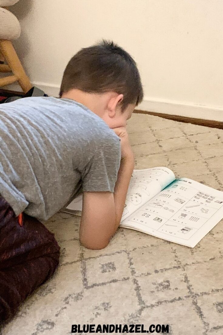 A 1st grade boy completing his homeschool math from the Singapore Math Primary US Edition level 1A. 