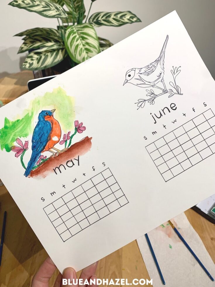 A print out of a calendar with a bird that is painted with watercolor.