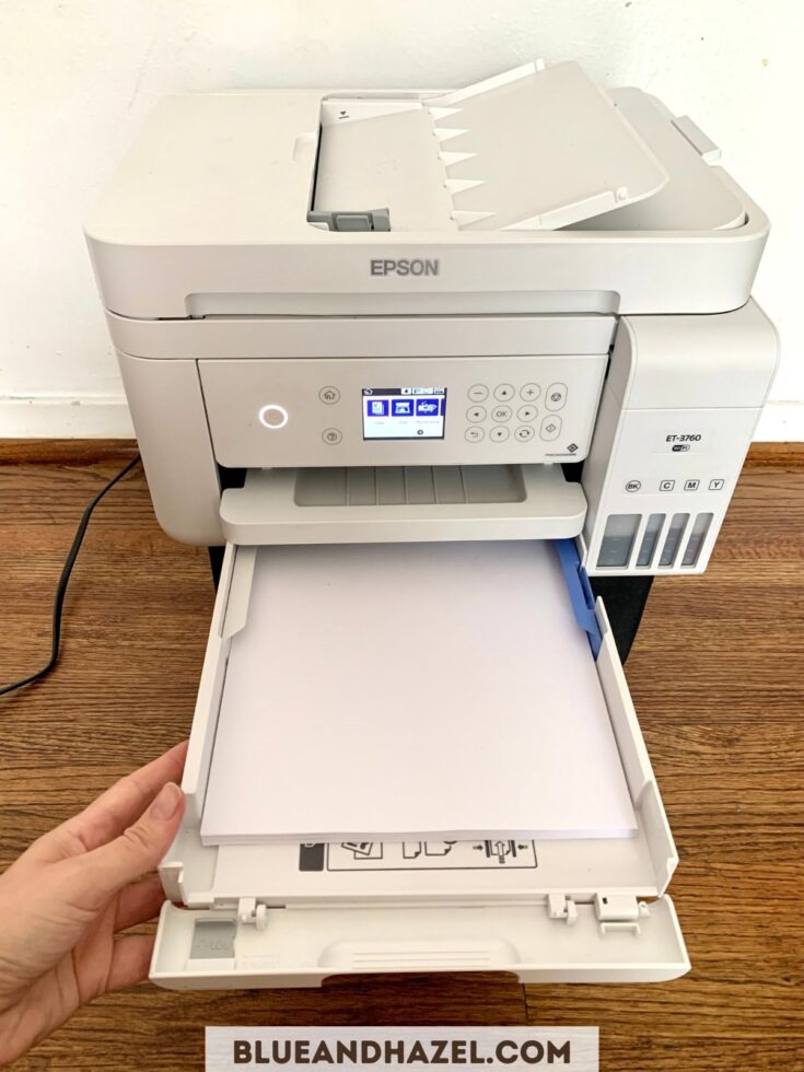 Adding paper to the Epson Ecotank 3760 printer. It's the best color printer for homeschooling!