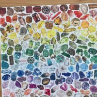 A completed 500 piece gemstone puzzle in rainbow format