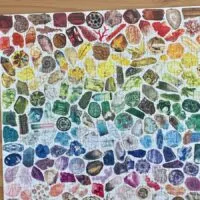 A completed 500 piece gemstone puzzle in rainbow format