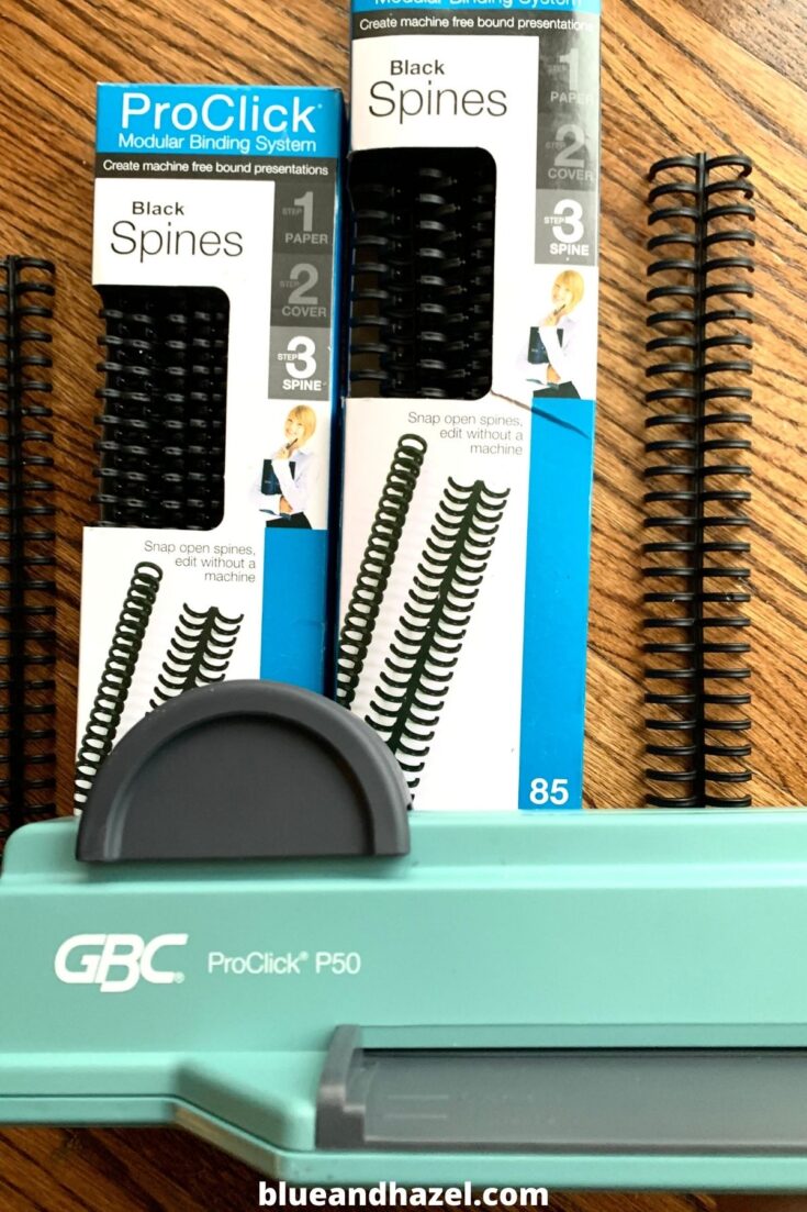 A close up of the GBC ProClick next to two sizes of black spines