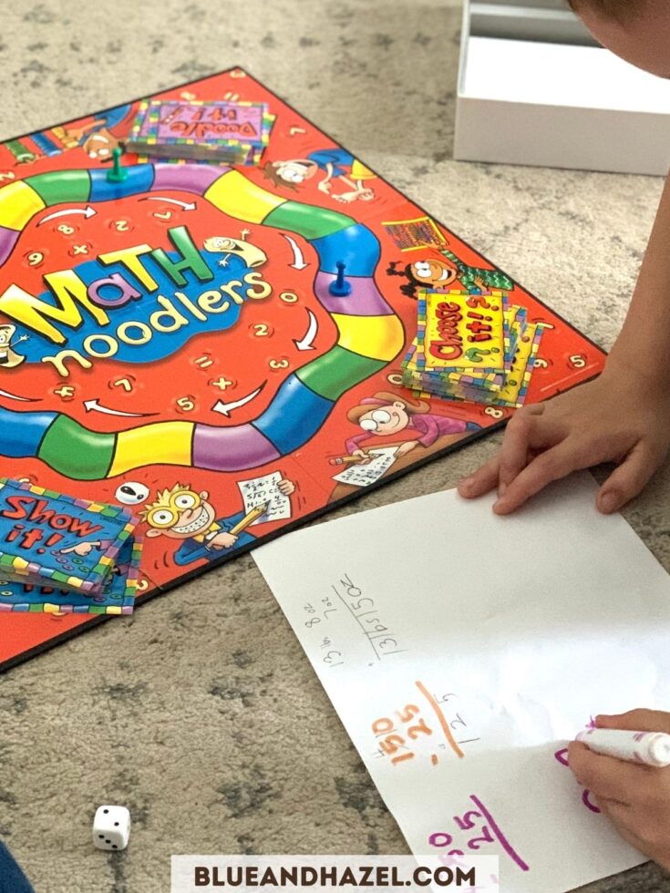 math noodlers board game being played by a second grader. 