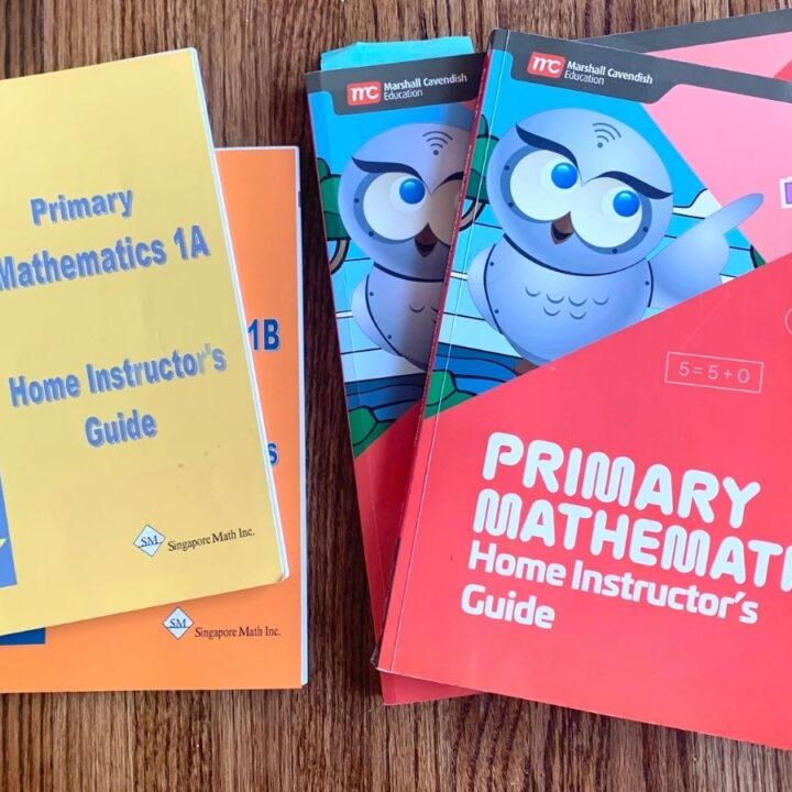 Singapore Math US home instructor's guides for level 1 next to the home instructor's guides for the new Primary 2022