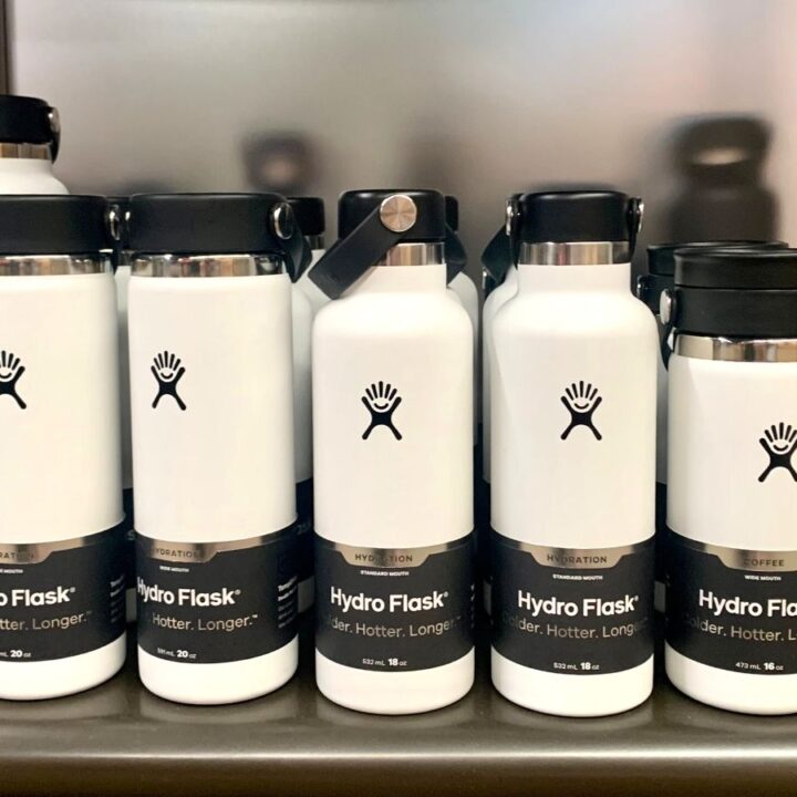 White new Hydro Flask bottles of different sizes on a store shelf