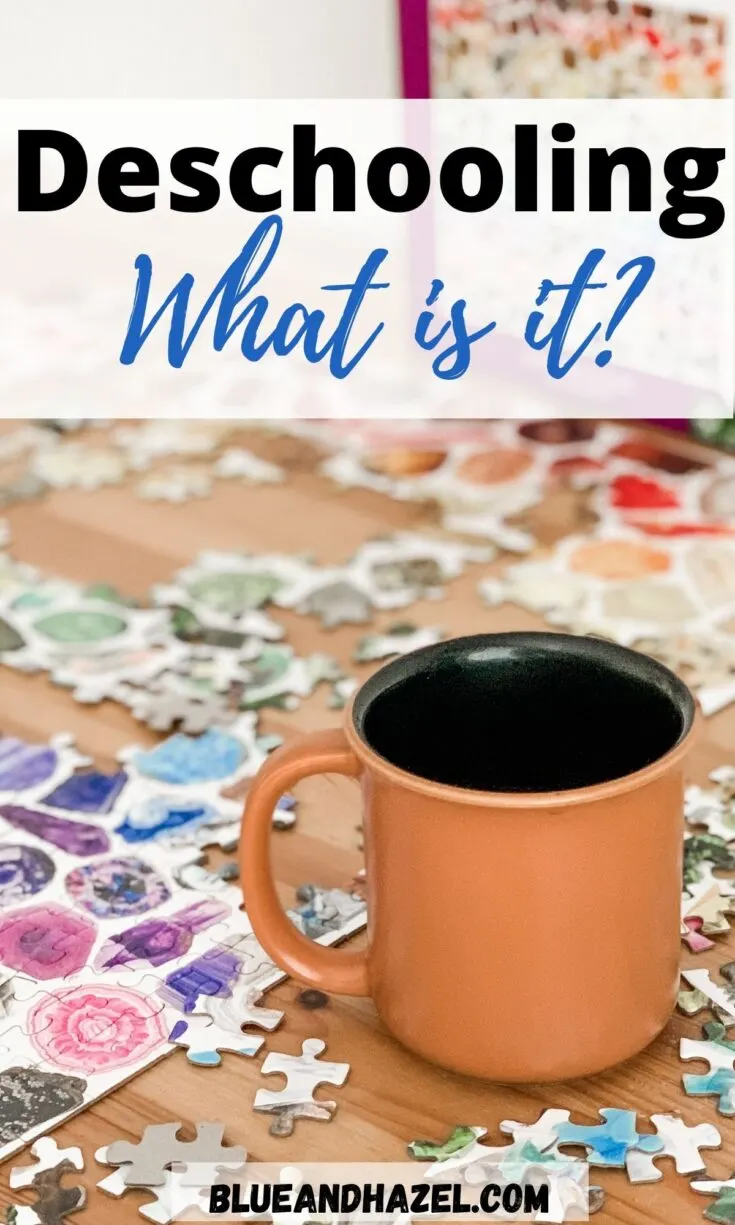 A ceramic mug on a table with a puzzle in progress during deschooling.