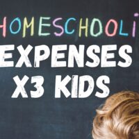 A child writing on a chalkboard with chalk letters saying homeschool expenses