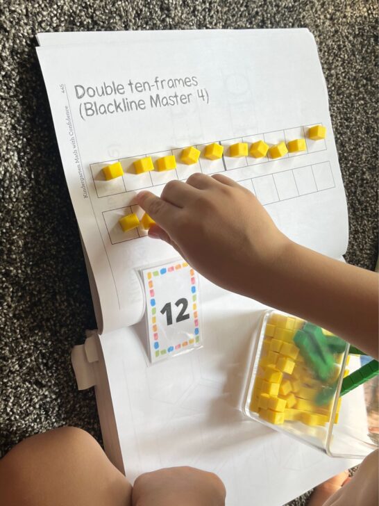 Double 10 frames from Kindergarten math With Confidence with yellow counters used to fill 12 boxes.