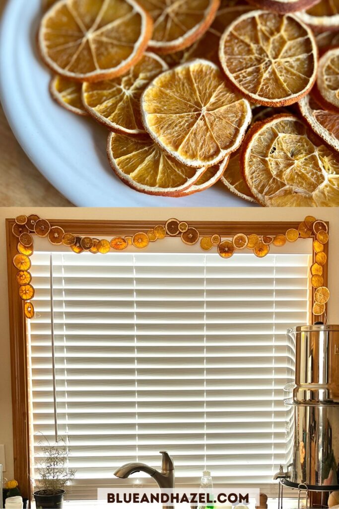 An orange garland hanging over a kitchen window.