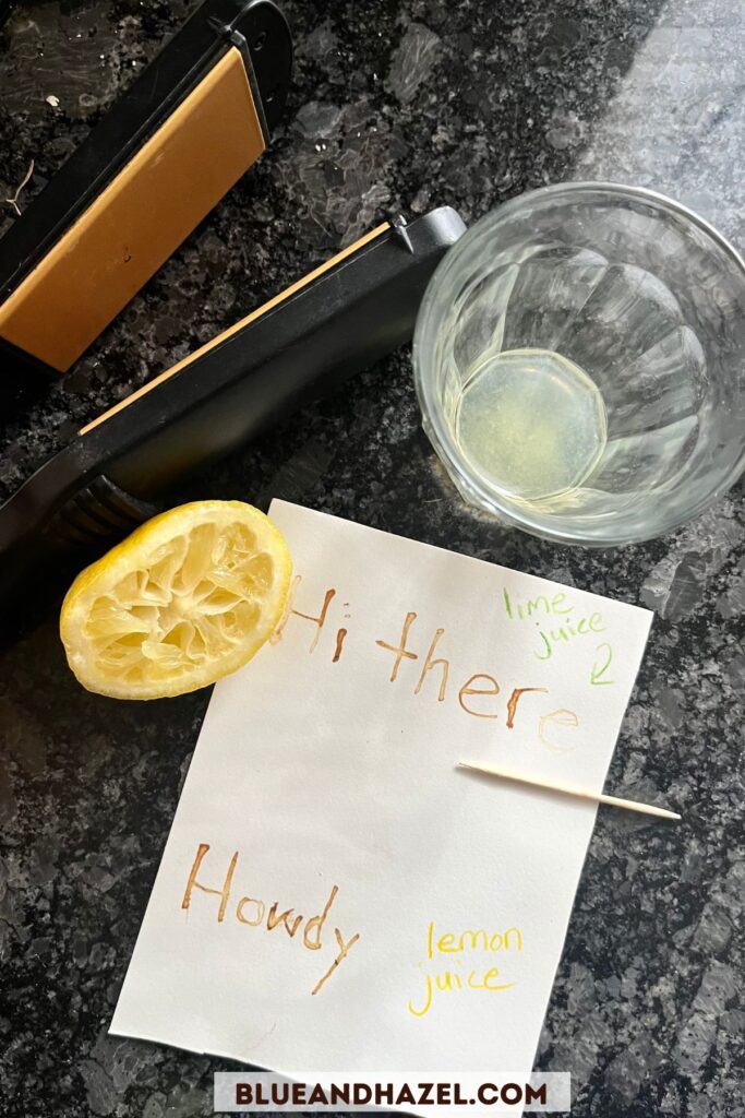 Brown letters on watercolor paper made from lemon juice and heat using the invisible ink experiment. 