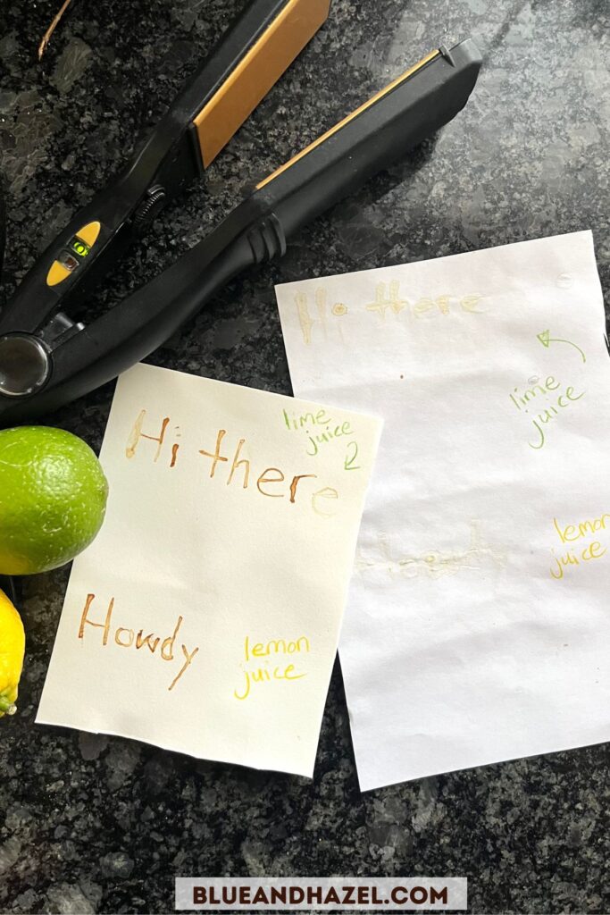 Watercolor paper with words saying "hi there" made by using lemon juice as invisible ink and adding heat to brown the letters. 