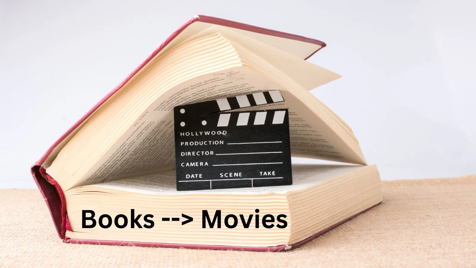 A book with a movie film cut piece inside, with words saying books made into movies.