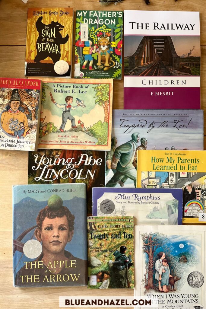 Living books used in a Charlotte Mason homeschool including Sign Of The Beaver, The Apple And The Arrow, Twenty and Ten, My Father's Dragon, The Remarkable Journey Of Prince Jen, Trapped By The Ice, The Railway Children, and When I Was Young In The Mountains