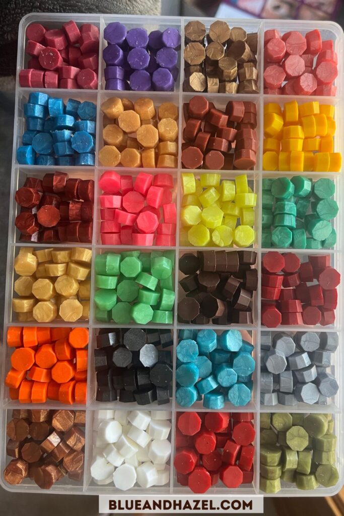 Wax melts in a variety of colors for sealing a letter using a wax stamp kit. 