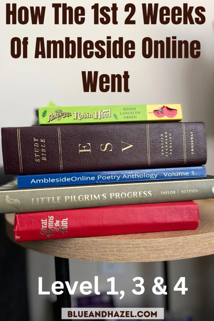 Morning time books on a table for a Charlotte Mason homeschool using Ambleside Online. Great hymns of the faith, Little Pilgrims Progress, Ambleside Online poetry Anthology volume 1, Robin Hood read aloud, and the ESV bible. 